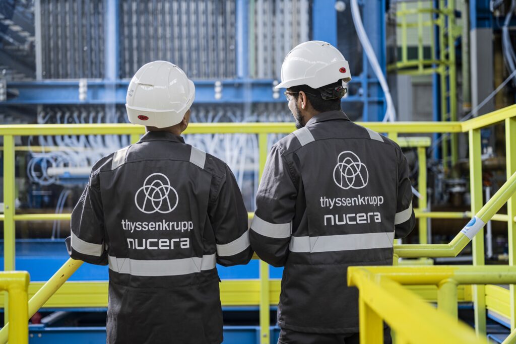 Employees at alkaline water electrolyzer